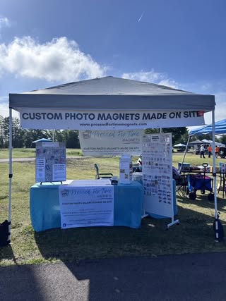 Magnet making booth setup at a craft fair by Shirey